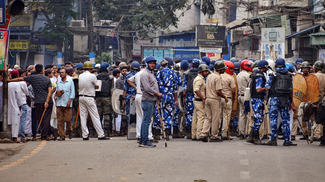 Security personnel cordon off an area after clashes broke out between two groups during a 'Ram Navami' procession on Thursday, at Kajipara in Howrah district, Friday, March 31, 2023. Credit: PTI Photo