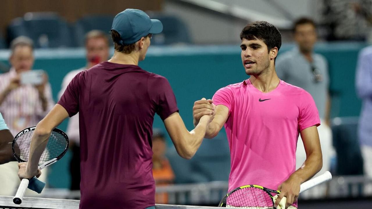 Jannik Sinner of Italy is congratulated by Carlos Alcaraz of Spain after their match during the semifinals of the Miami Open at Hard Rock Stadium. Credit: AFP Photo