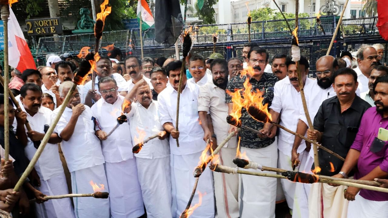 Members of United Democratic Front (UDF) during protest in front of the State Secretariat as they observe ‘black day’ over State Budget proposals taxing and imposing levies on fuel, liquor, piped water and power, in Thiruvananthapuram, Saturday, April 1, 2023. Credit: PTI Photo
