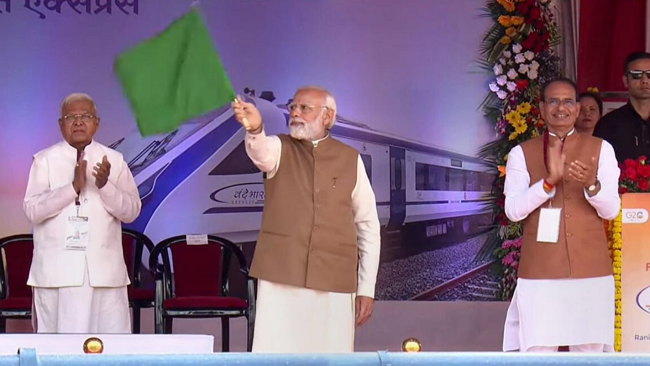 Prime Minister Narendra Modi flags off the Vande Bharat Express between Bhopal and New Delhi, in Bhopal, Saturday, April 1, 2023. Madhya Pradesh Governor Mangubhai Patel and Chief Minister Shivraj Singh Chouhan are also seen. Credit: PTI Photo