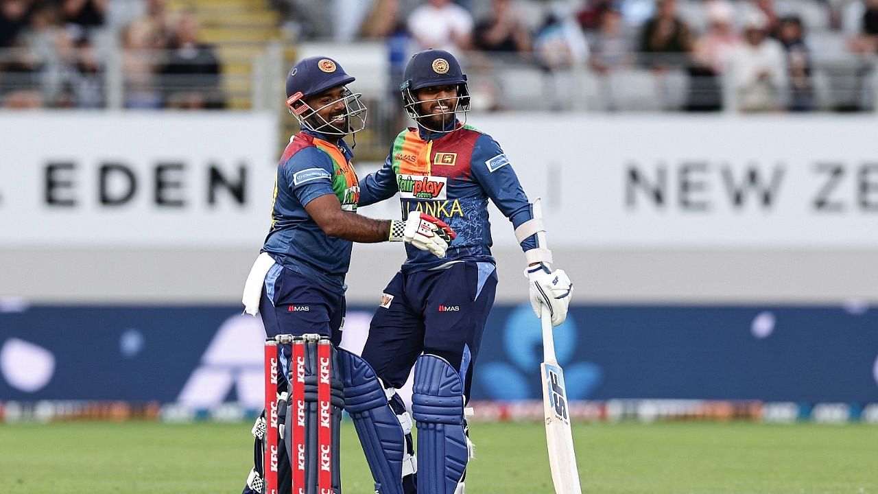 Sri Lanka's Charith Asalanka (L) and Kusal Mendis celebrate winning the super over. Credit: AFP Photo