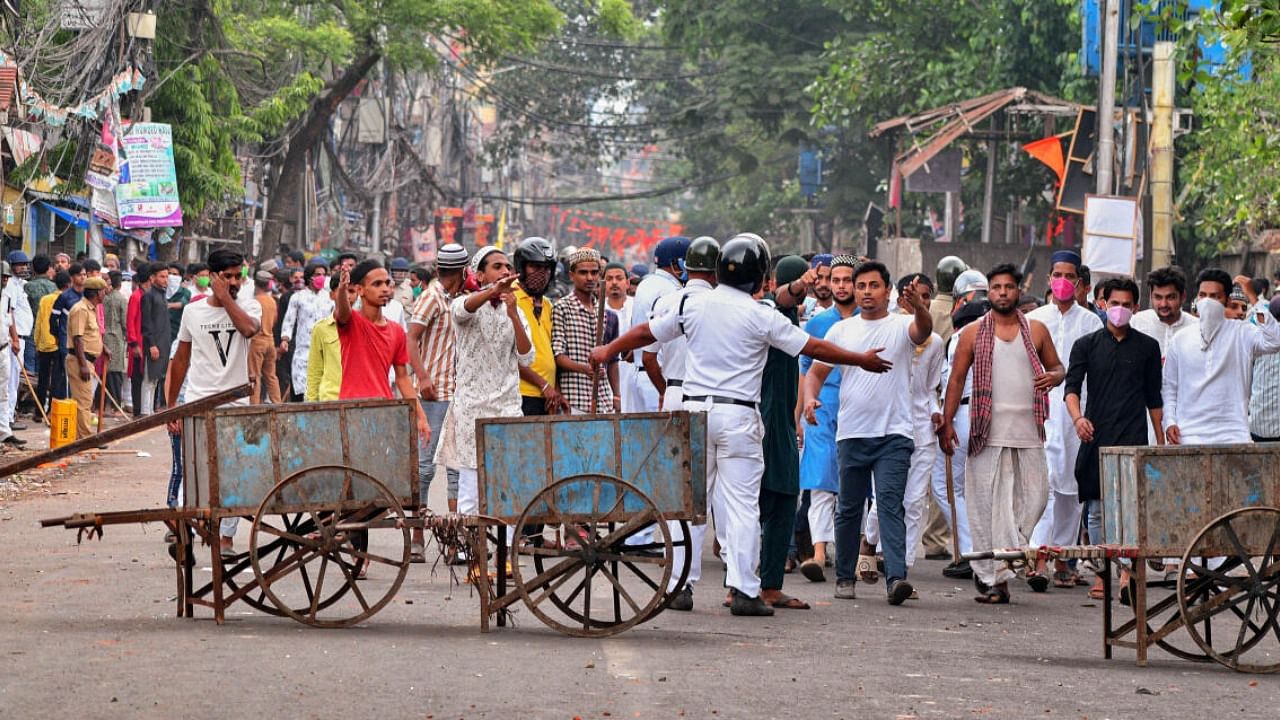 File photo of cops cordoning off an area after clashes broke out between two groups during a 'Ram Navami' procession on Thursday, at Kazipara, Howrah. Credit: PTI Photo