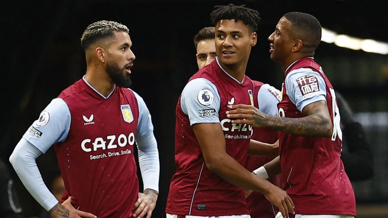 Aston Villa's Ollie Watkins celebrates scoring their first goal with Ashley Young and Douglas Luiz. Credit: Reuters Photo