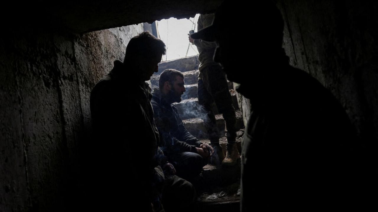 A Ukrainian tank unit crew takes cover in a bunker in Bakhmut. Credit: Reuters Photo