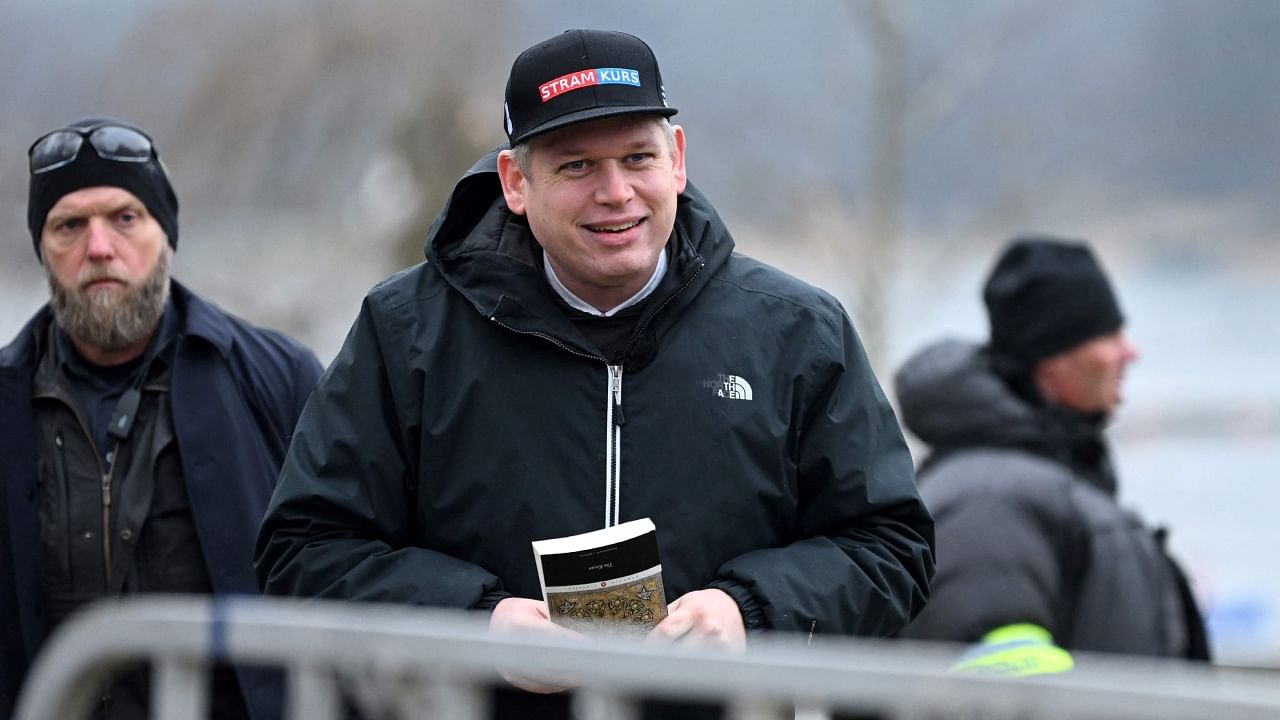 In this file photo taken on January 21, 2023 the leader of the far-right Danish political party Stram Kurs, Swedish-Danish politician Rasmus Paludan is pictured while holding The Quran, while staging a protest outside the Turkish Embassy in Stockholm, Sweden. Credit: AFP Photo