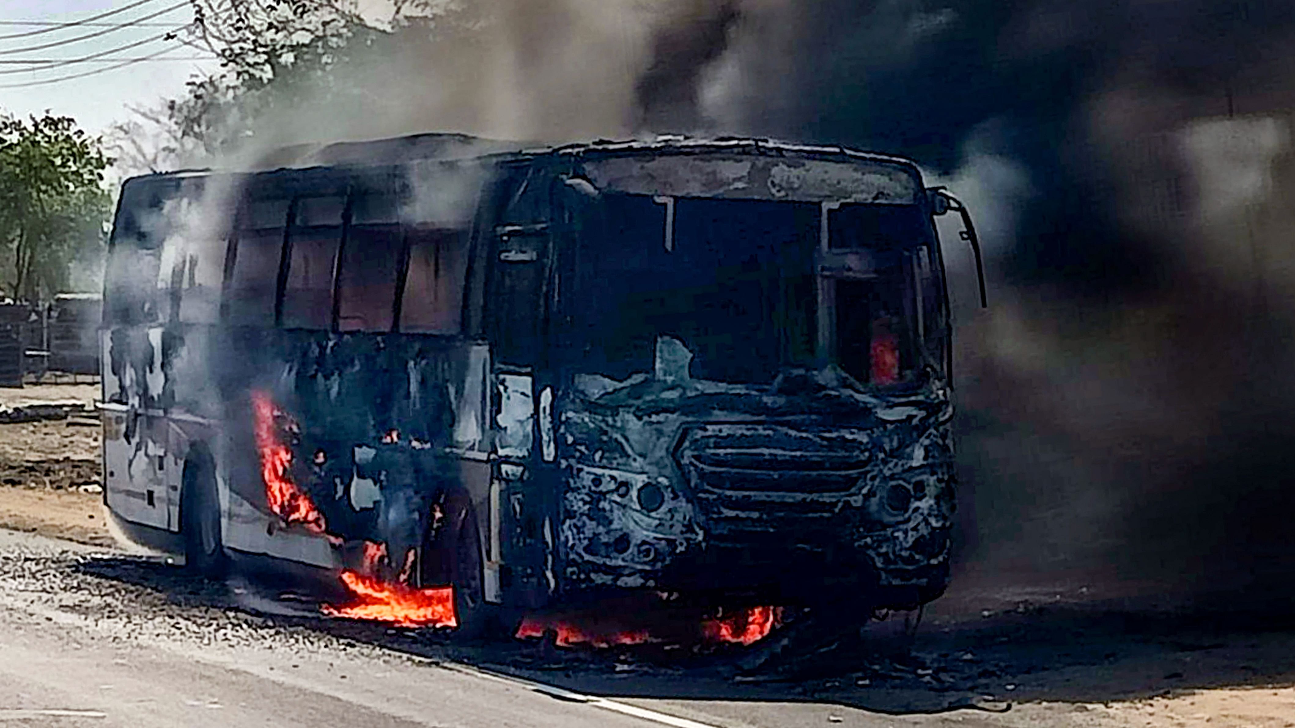 Smoke rises from an Amravati-bound Maharashtra State Road Transport Corporation (MSRTC) bus that caught fire in Nagpur district, Tuesday, April 4, 2023. Credit: PTI Photo