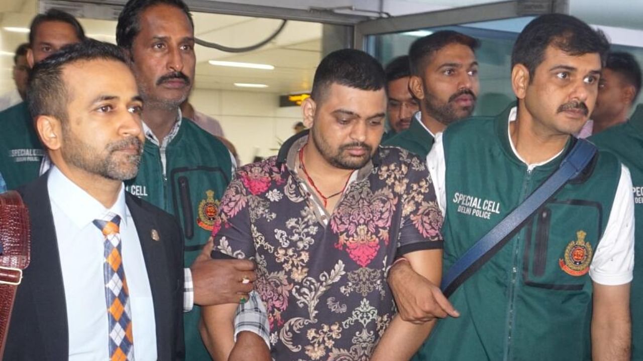 <div class="paragraphs"><p>File Photo: Gangster Deepak 'Boxer', a wanted fugitive in India, being brought from Mexico by Delhi Police's special cell team following his arrest, in New Delhi. </p></div>