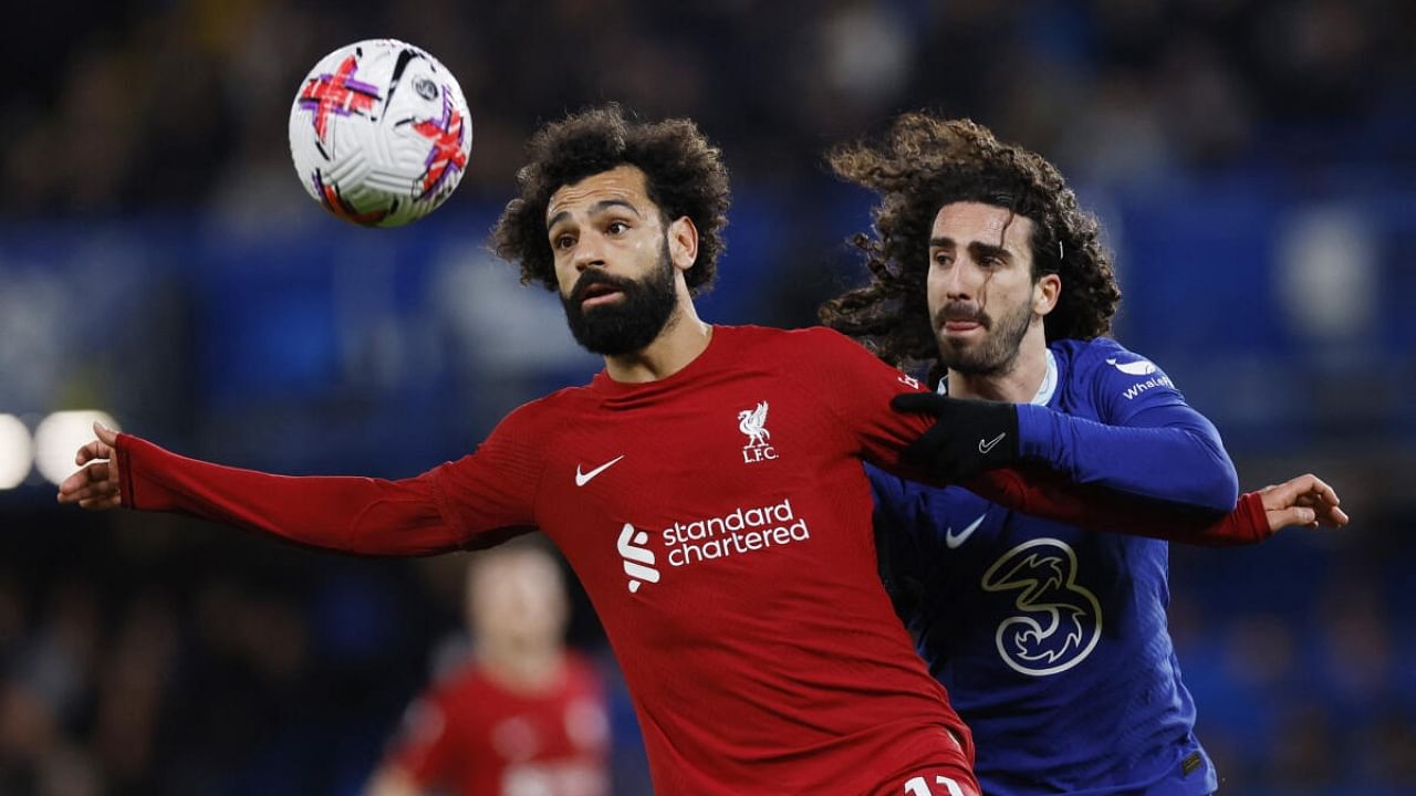 Liverpool's Mohamed Salah in action with Chelsea's Marc Cucurella. Credit: Reuters Photo
