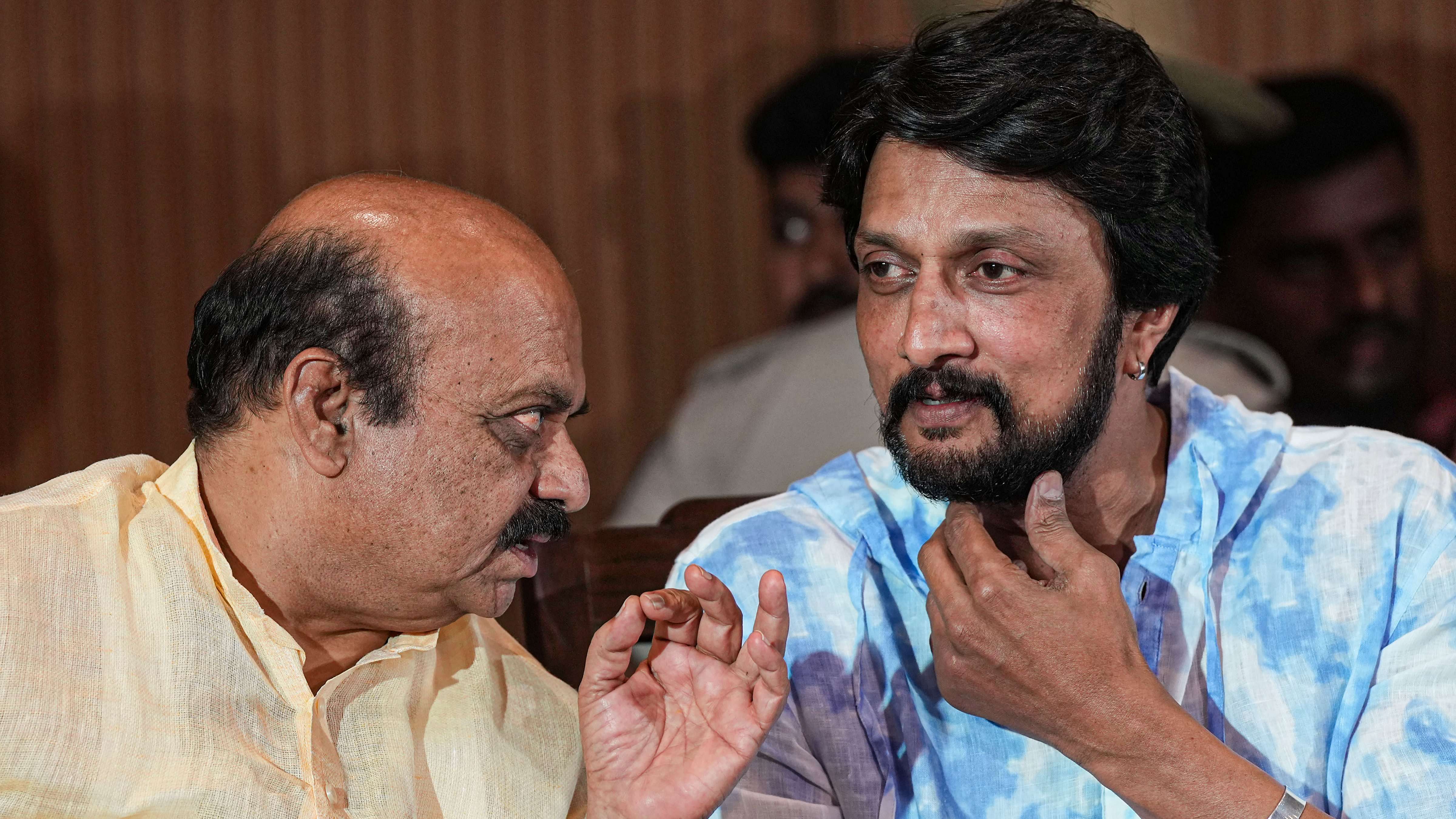 Karnataka Chief Minister Basavaraj Bommai with Kannada actor Kiccha Sudeep. Credit: PTI Photo