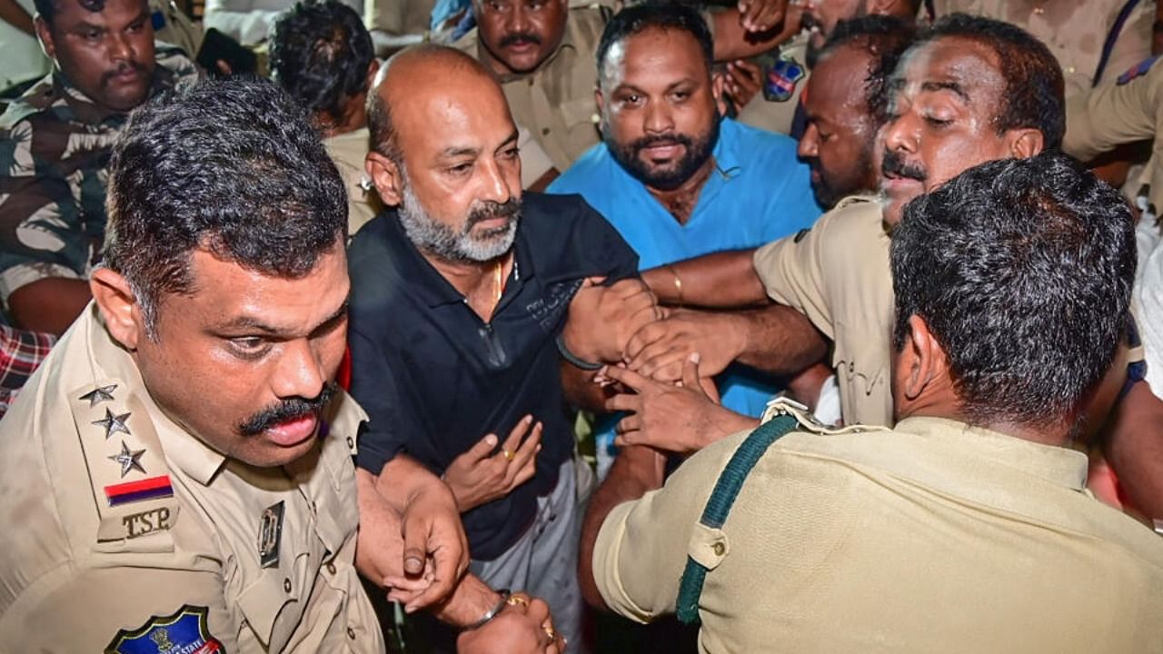 Telangana BJP President and MP Bandi Sanjay Kumar being detained by the police from his residence after midnight in Karimnagar, Wednesday, April 5, 2024. Credit: PTI Photo