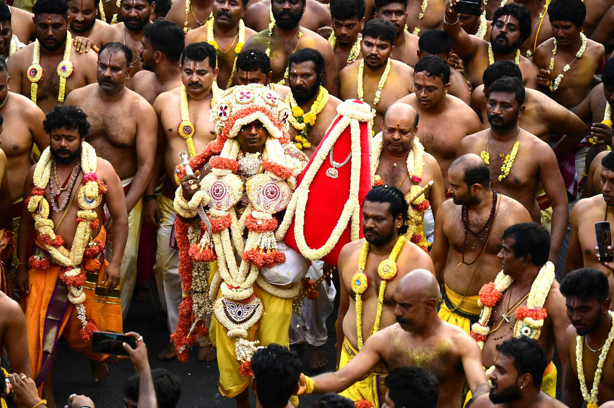 The head priest takes out a procession to the Shri Dharmaraya Swamy temple in Thigalarpet. Credit: DH PHOTO/Kishor Kumar Bolar