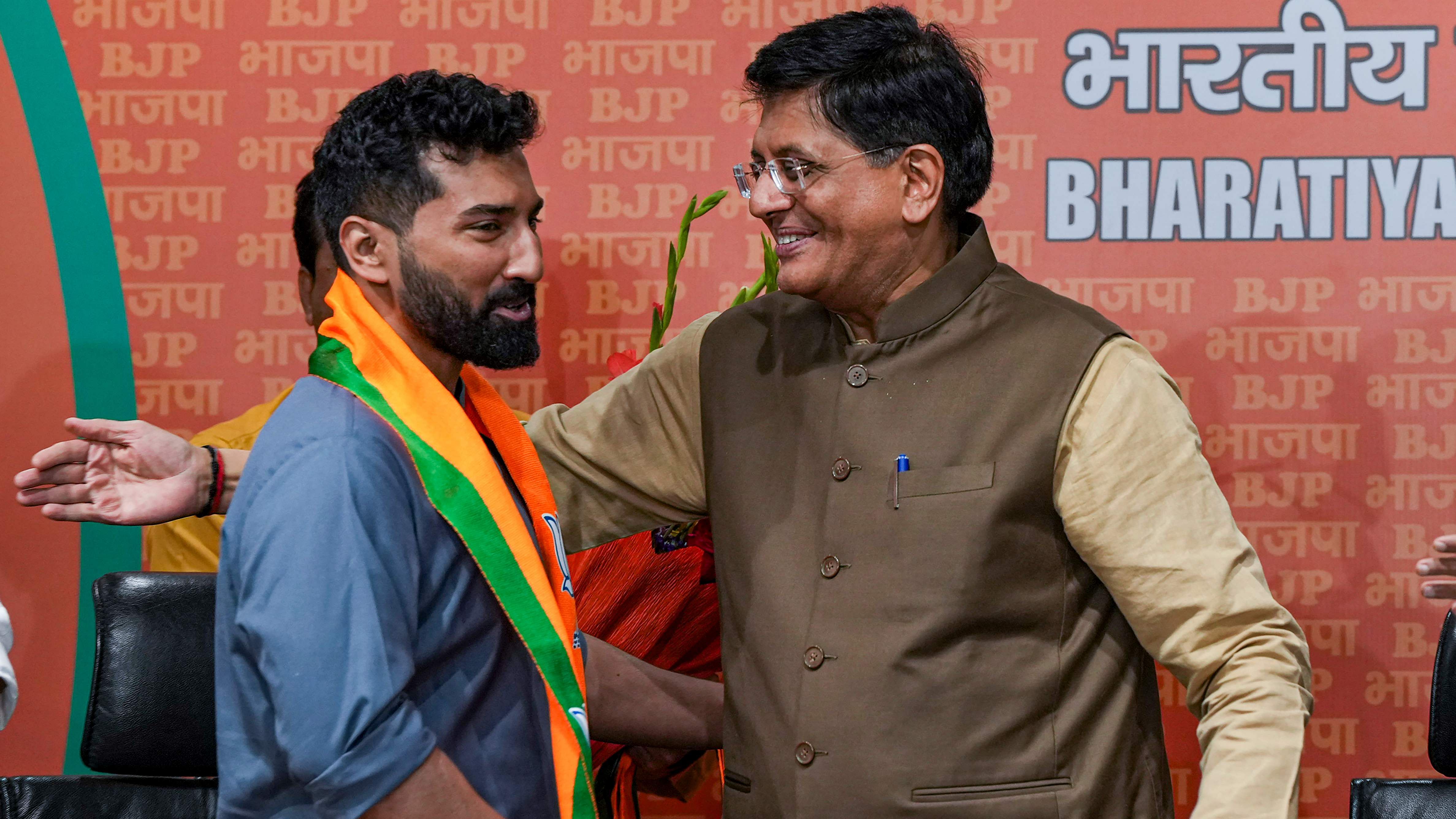 Anil Antony, son of Congress veteran and former defence minister AK Antony, with Union Minister and senior BJP leader Piyush Goyal. Credit: PTI Photo