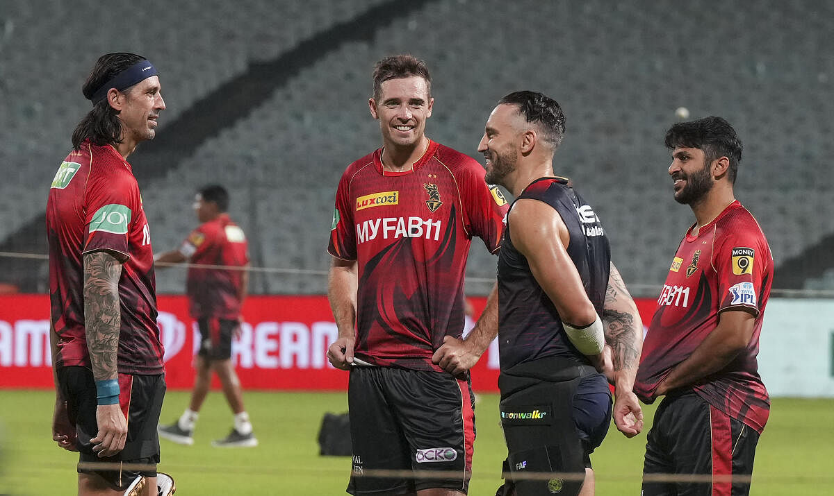 Royal Challengers Bangalore player Faf du Plessis with Kolkata Knight Riders players during their training session on the eve of their IPL 2023 cricket match, at Eden Gardens, in Kolkata, Wednesday, April 5, 2023. Credit: PTI Photo