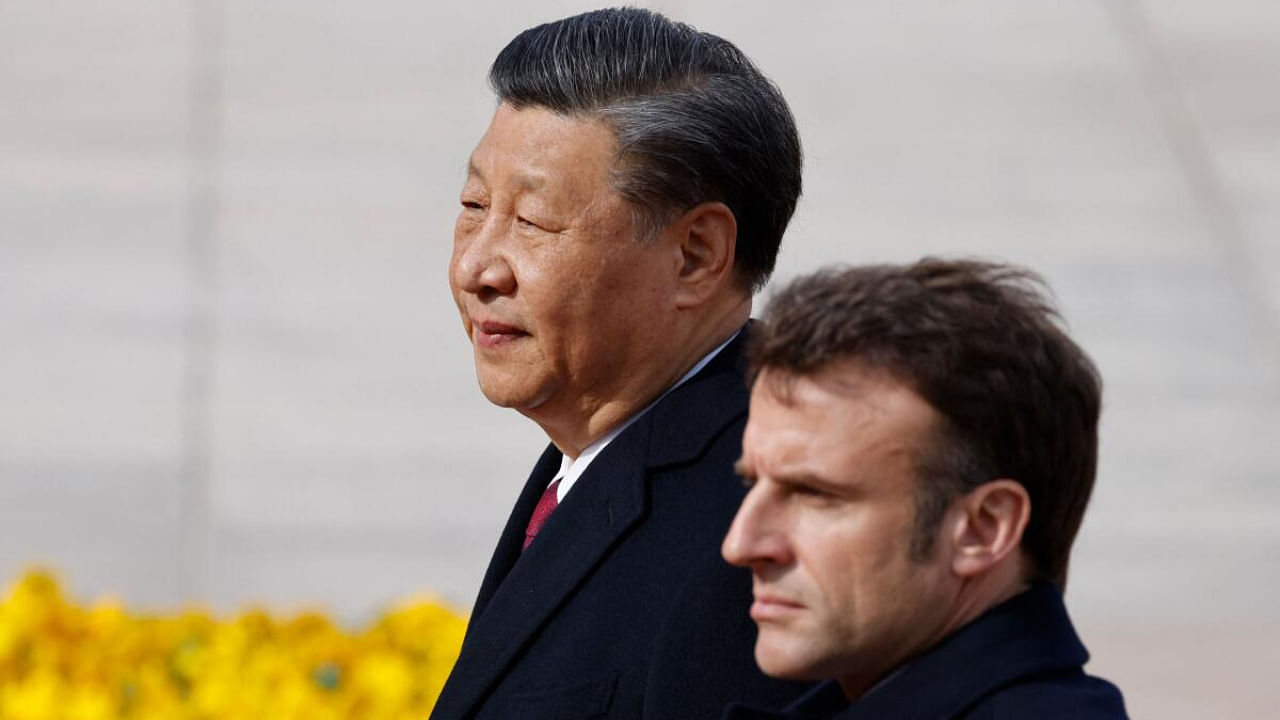 Xi Jinping and Emmanuel Macron in Beijing. Credit: AFP Photo