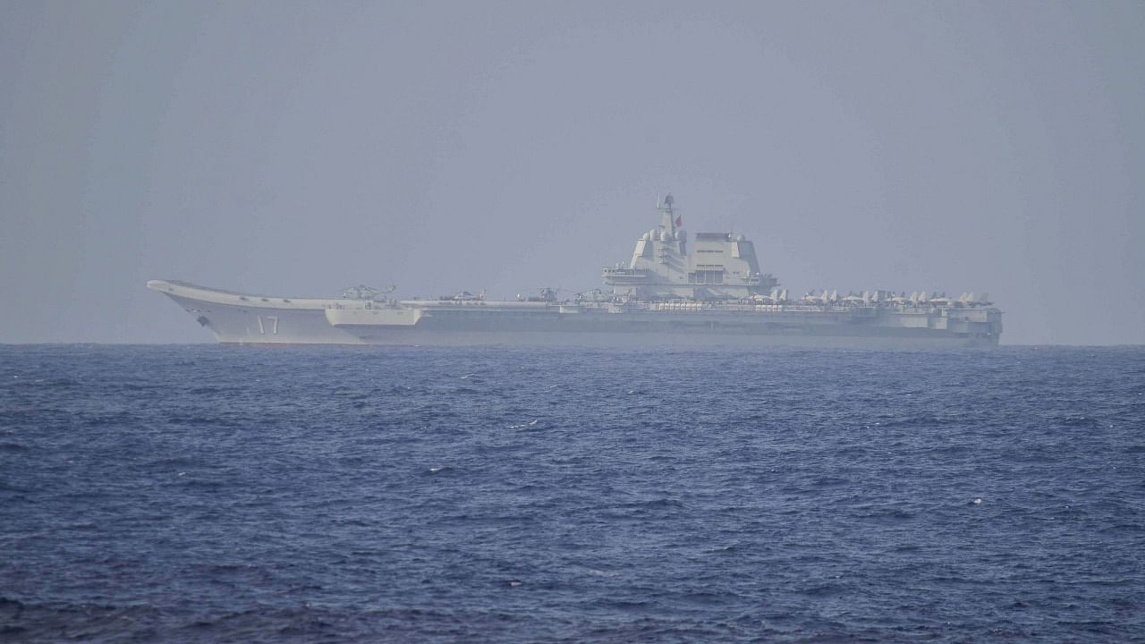 The Chinese aircraft carrier Shandong in Pacific Ocean waters, some 300 kms (186 miles) south of Okinawa prefecture. Credit: AFP Photo