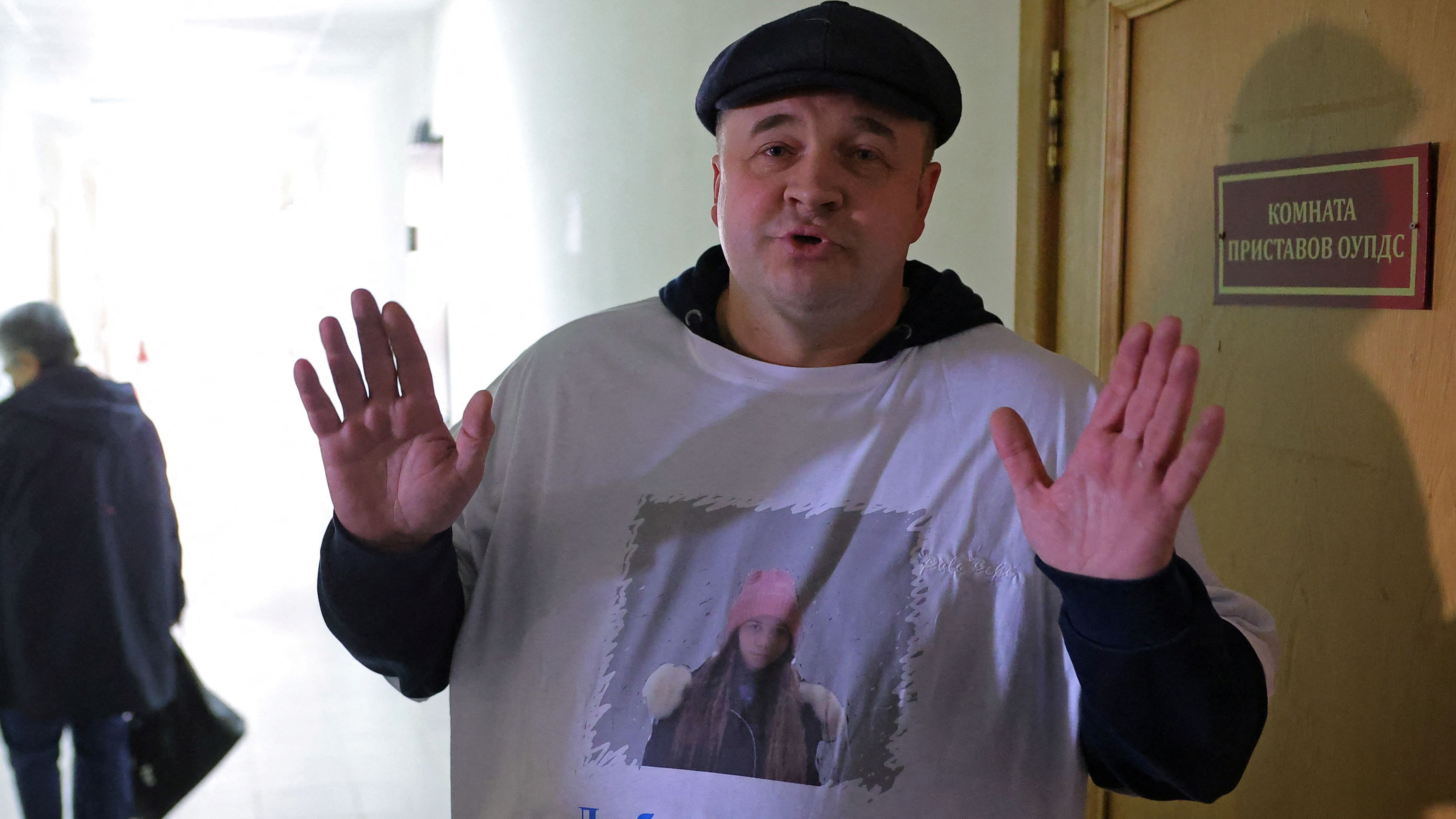 Roman, a supporter of Russian citizen Alexei Moskalyov, who is accused of discrediting the country's armed forces in the course of Russia-Ukraine military conflict, speaks to the media in a courthouse in the town of Yefremov in the Tula region, Russia, April 6, 2023. Roman wears a t-shirt with a portrait of Moskalyov's daughter Masha and the slogan: "Loving a father is not a crime!". Credit: Reuters Photo