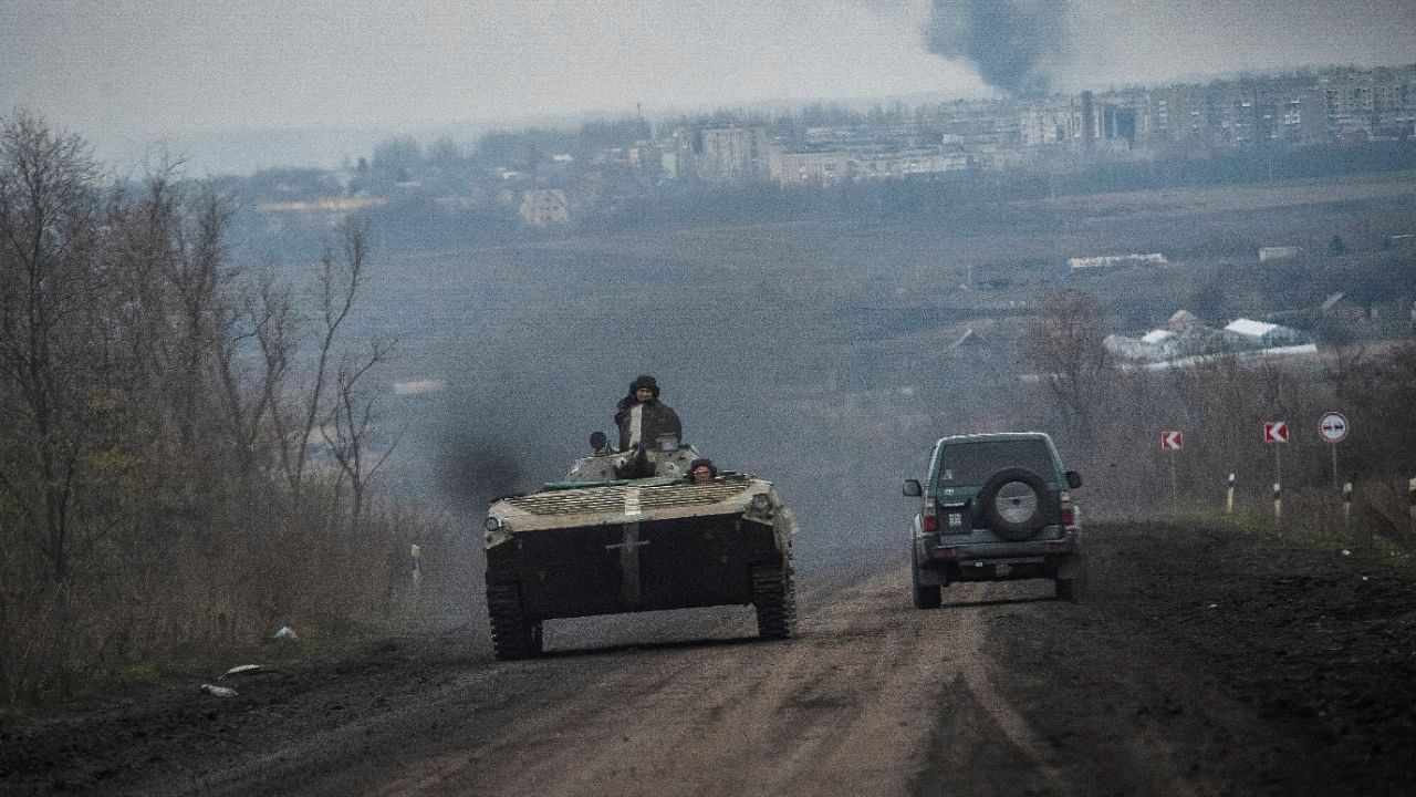 Ukrainian service members ride a BMP-1 infantry fighting vehicle, as Russia's attack on Ukraine continues, near the front line city of Bakhmut. Credit: Reuters Photo