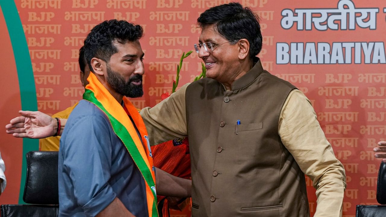 Anil Antony, son of Congress veteran and former defence minister AK Antony, with Union Minister and senior BJP leader Piyush Goyal after the former joined the Bharatiya Janata Party. Credit: PTI Photo