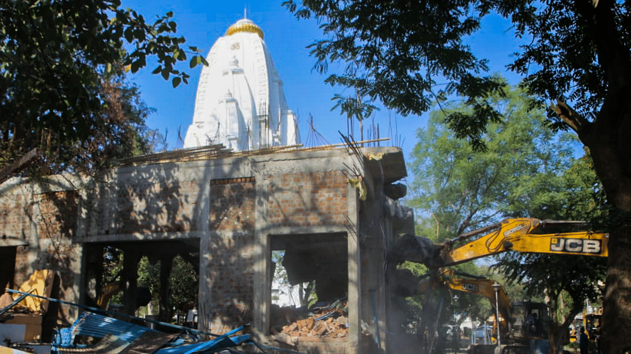 The demolition of illegal construction at the Beleshwar Jhulelal Mahadev Temple, Indore. Credit: PTI Photo