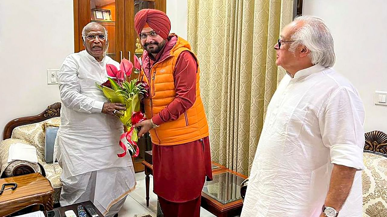 Congress leader Navjot Singh Sidhu meets party President Mallikarjun Kharge, in New Delhi. Congress leader Jairam Ramesh is also seen. Credit: PTI Photo