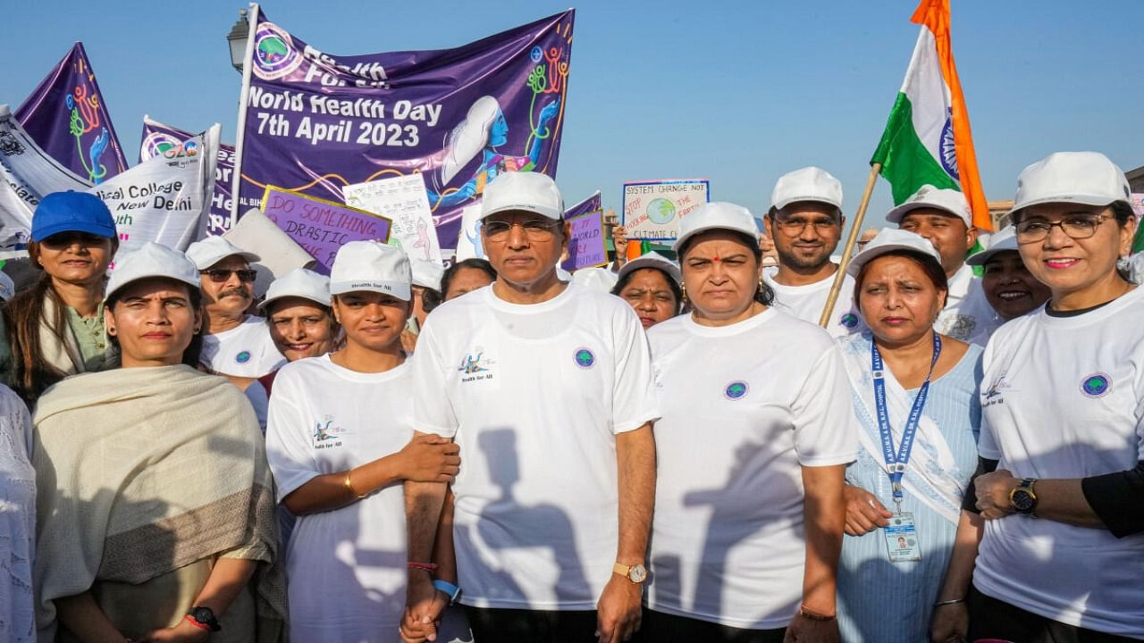 Union Minister of Health and Family Welfare Mansukh Mandaviya with Union MoS for Health & Family Welfare Bharati Pawar and others participates in a walkathon from Vijay Chowk to Nirman Bhavan on the occasion of World Health Day, in New Delhi. Credit: PTI Photo