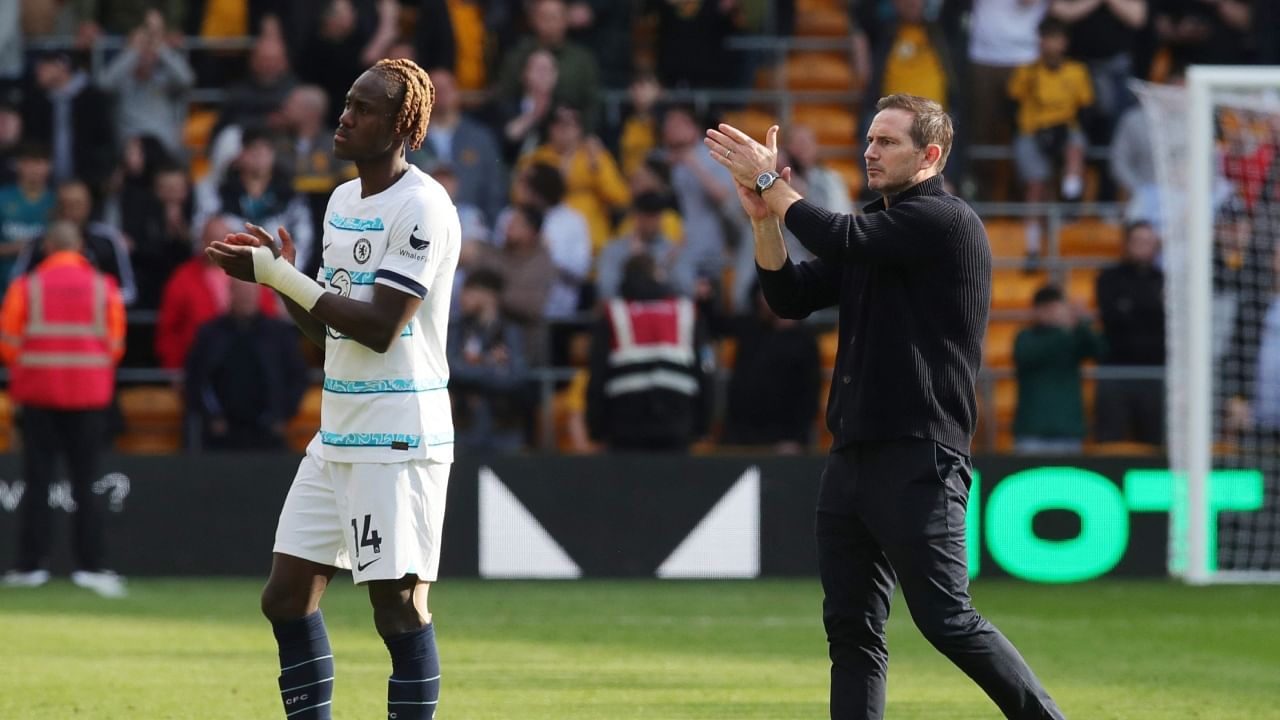 Chelsea manager Frank Lampard and Chelsea's Trevoh Chalobah applaud the fans after the match on April 8, 2023. Credit: Reuters Photo