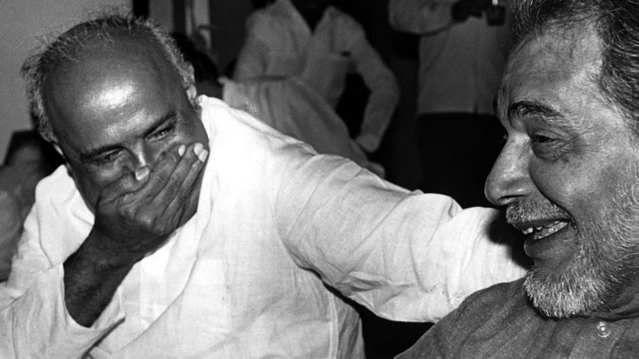 In this undated photo Janata Party leaders H D Deve Gowda and Ramakrishna Hegde were seen bursting into hearty laughter. Credit: DH File Photo