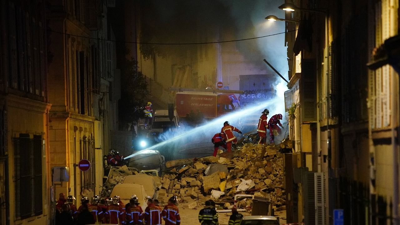 Firefighters work after building collapsed early Sunday, April 9, 2023 in Marseille, southern France. Credit: AP Photo