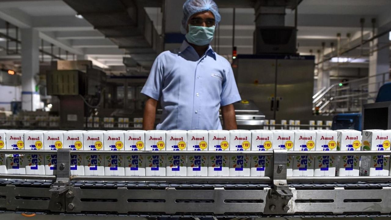 Tetra packs of Amul lassi going through the production line. Credit: AFP File Photo