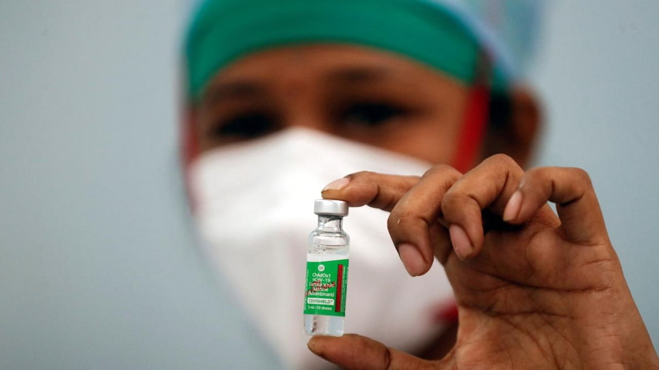 A nurse displays a vial of AstraZeneca's Covishield vaccine. credit: Reuters File Photo