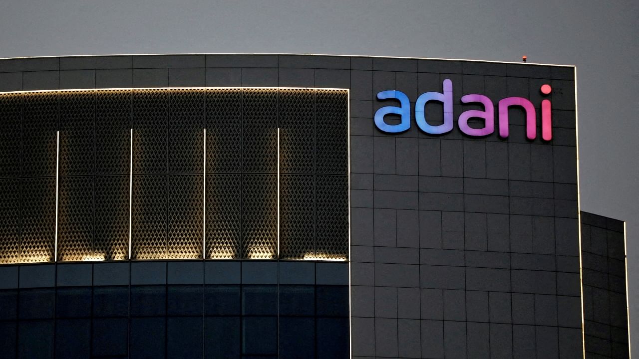 The logo of the Adani group is seen on the facade of one of its buildings on the outskirts of Ahmedabad, India, April 13, 2021. Credit: Reuters File Photo