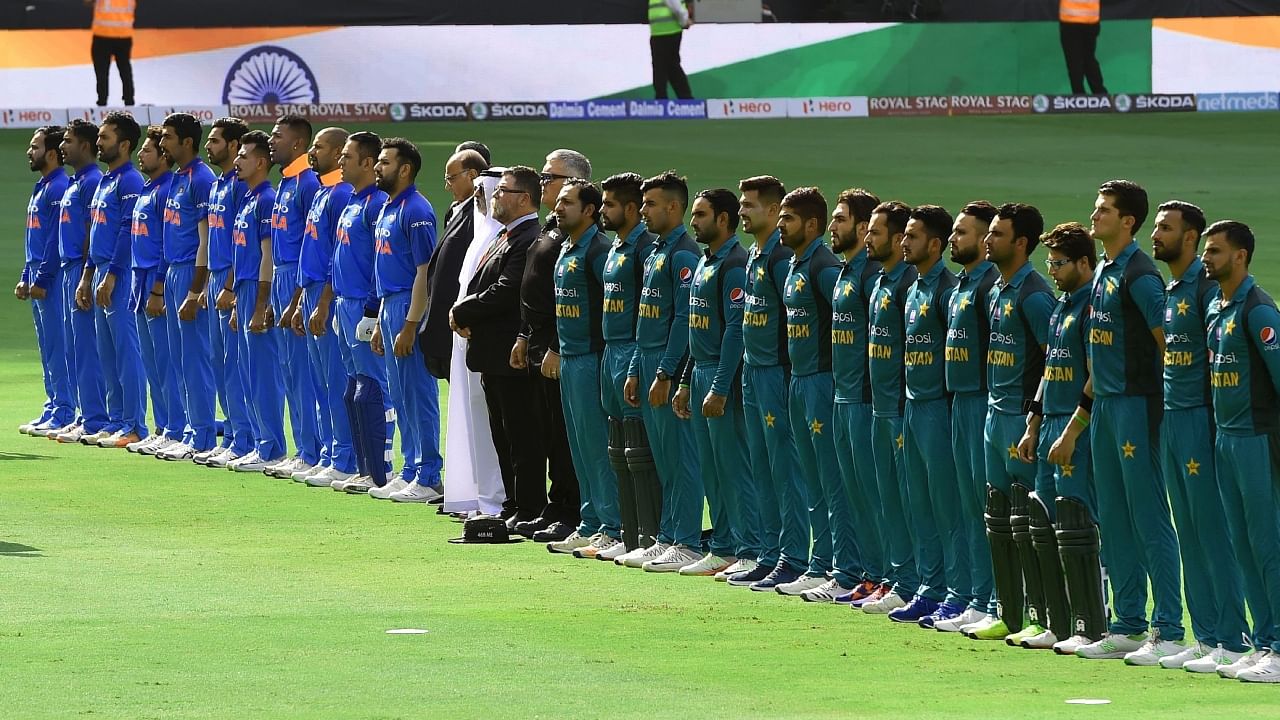 Indian and Pakistani players line up for the national anthem just before the start of the one day international (ODI) Asia Cup cricket match between Pakistan and India at the Dubai International Cricket Stadium in Dubai on September 19, 2018. Credit: AFP File Photo