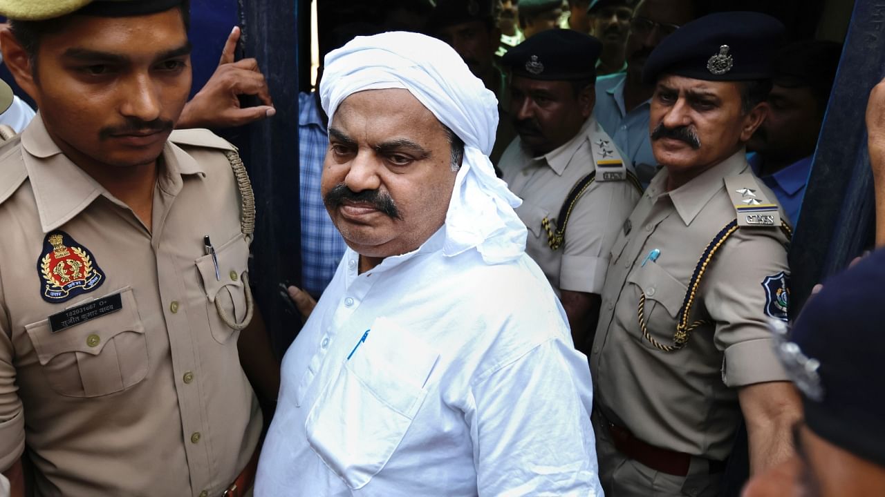 Gangster-turned-politician Atiq Ahmed being brought from Sabarmati Central Jail to present again before a Prayagraj court in the Umesh Pal murder case, in Ahmedabad, Tuesday, April 11, 2023. Credit: PTI Photo