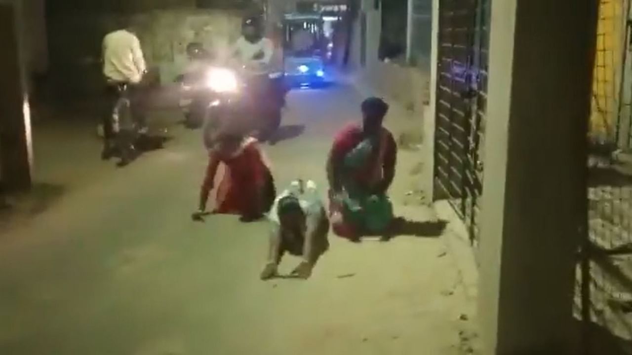 Screengrab from video showing the three tribal woman being made to crawl from a BJP office to a TMC office in Bengal. Credit: Twitter/@BJP4Bengal