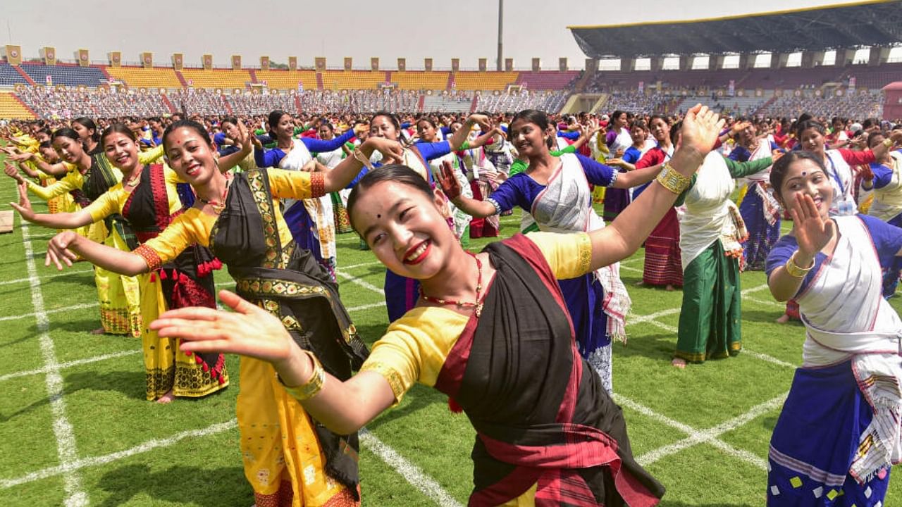 The dancers and drummers, who came from across Assam and have been rehearsing at the Sarusajai Sports complex in Guwahati for the past two days, will perform the Bihu together between 5.30 pm and 6.30 pm. Credit: PTI Photo