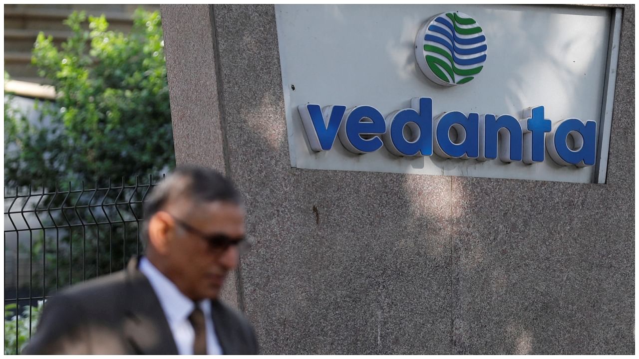 A man walks past the logo of Vedanta outside its headquarters in Mumbai. Credit: Reuters