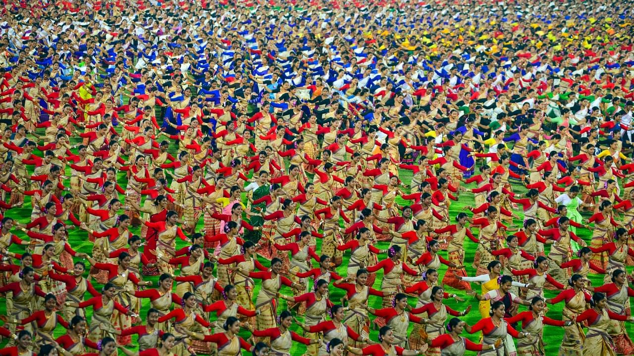 Bihu dancers perform to set a Guinness World Record at Sarusajai stadium in Guwahati on April 13, 2023. Credit: AFP Photo