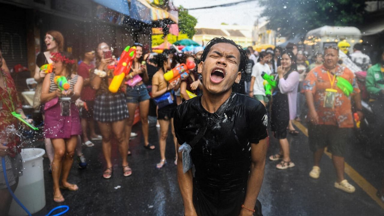 Locals and tourists play with water as they celebrate the Songkran holiday which marks the Thai New Year in Bangkok. Credit: Reuters Photo