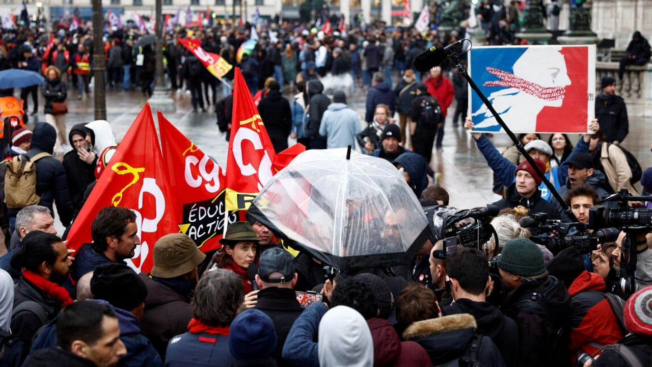 Protestors demonstrate after the Constitutional Council approved most of the French government's pension reform, in Paris. credit: Reuters Photo