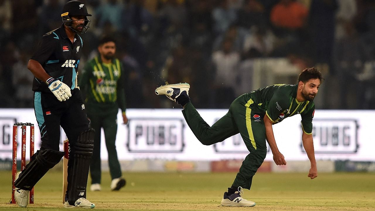 Pakistan's Haris Rauf (R) delivers a ball during the first Twenty20 cricket match between Pakistan and New Zealand at the Gaddafi Cricket Stadium in Lahore. Credit: AFP Photo