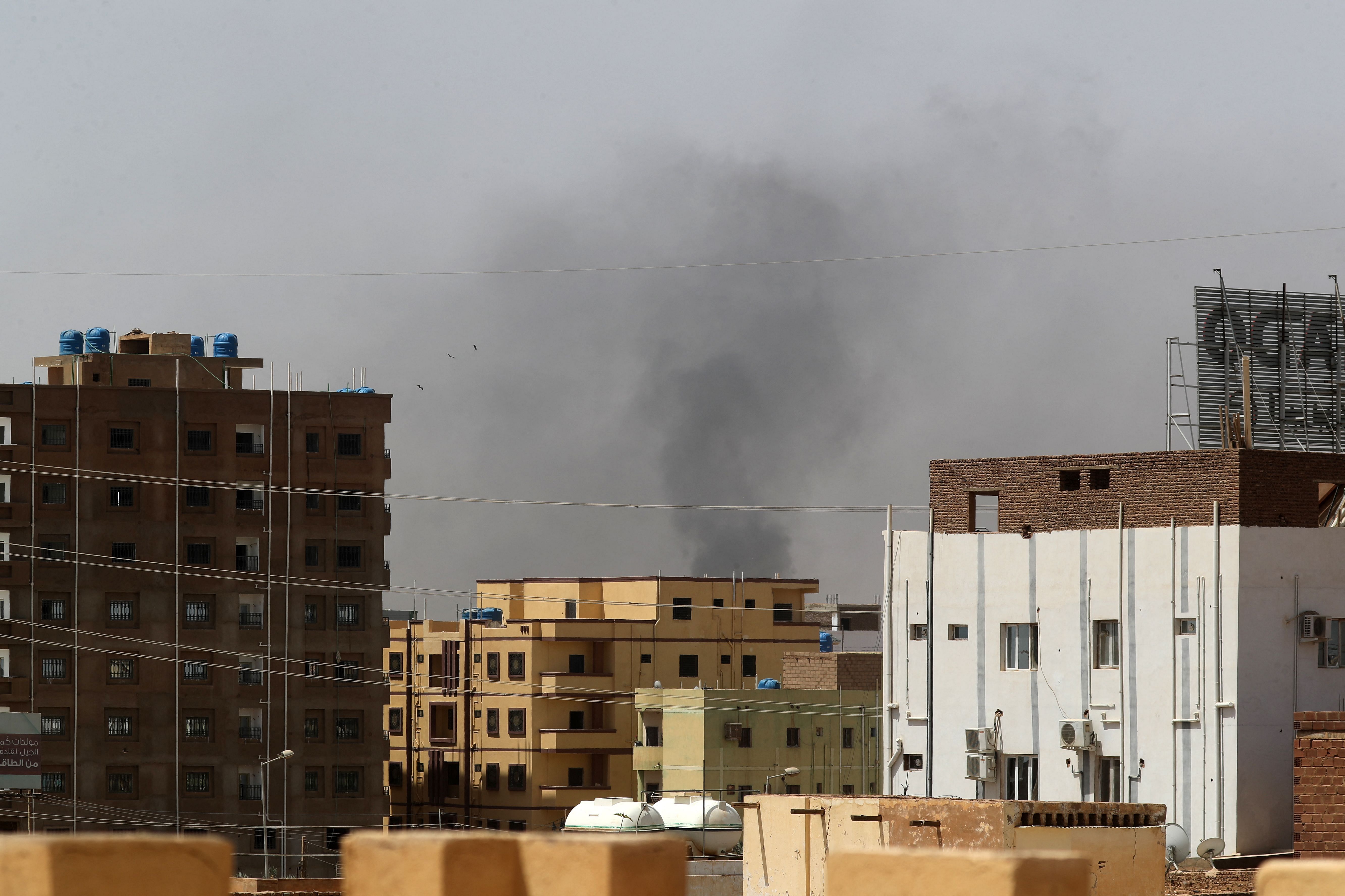 Smoke rises above buildings in Khartoum on April 15, 2023, amid reported clashes in the city. Credit: AFP Photo