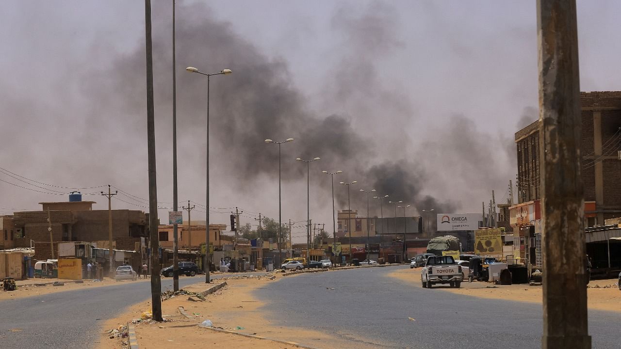 Smoke rises in Omdurman, near Halfaya Bridge, during clashes between the Paramilitary Rapid Support Forces and the army as seen from Khartoum North. Credit: Reuters Photo