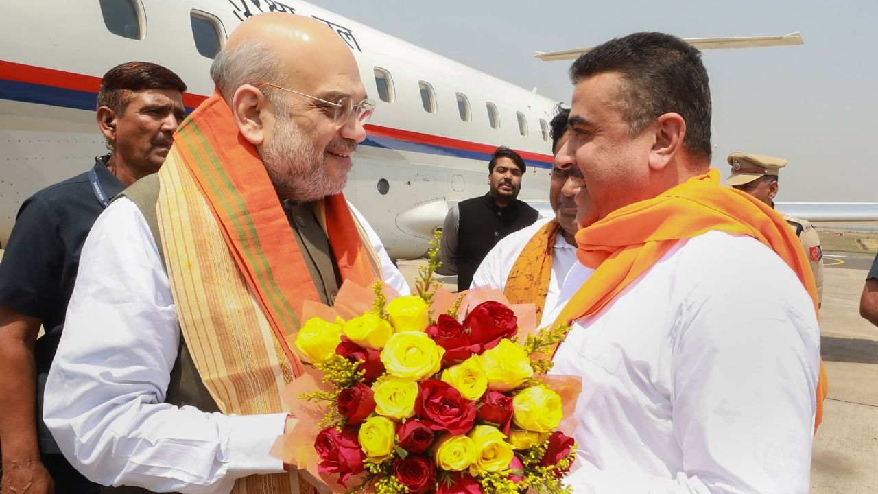 Union Home Minister Amit Shah being received by Suvendu Adhikari at the Durgapur airport, Friday, April 14, 2023. Credit: PTI Photo