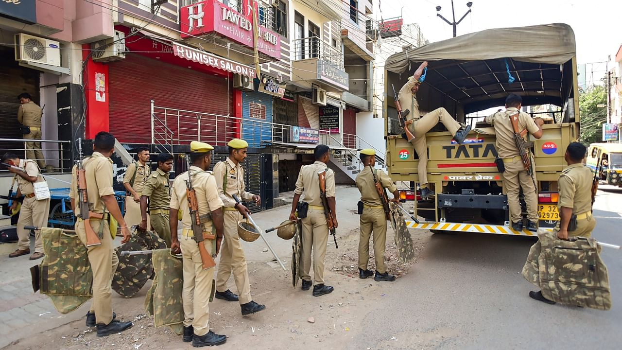 Security personnel being deployed in an area in view of Section 144 imposition in Uttar Pradesh. Credit: PTI Photo
