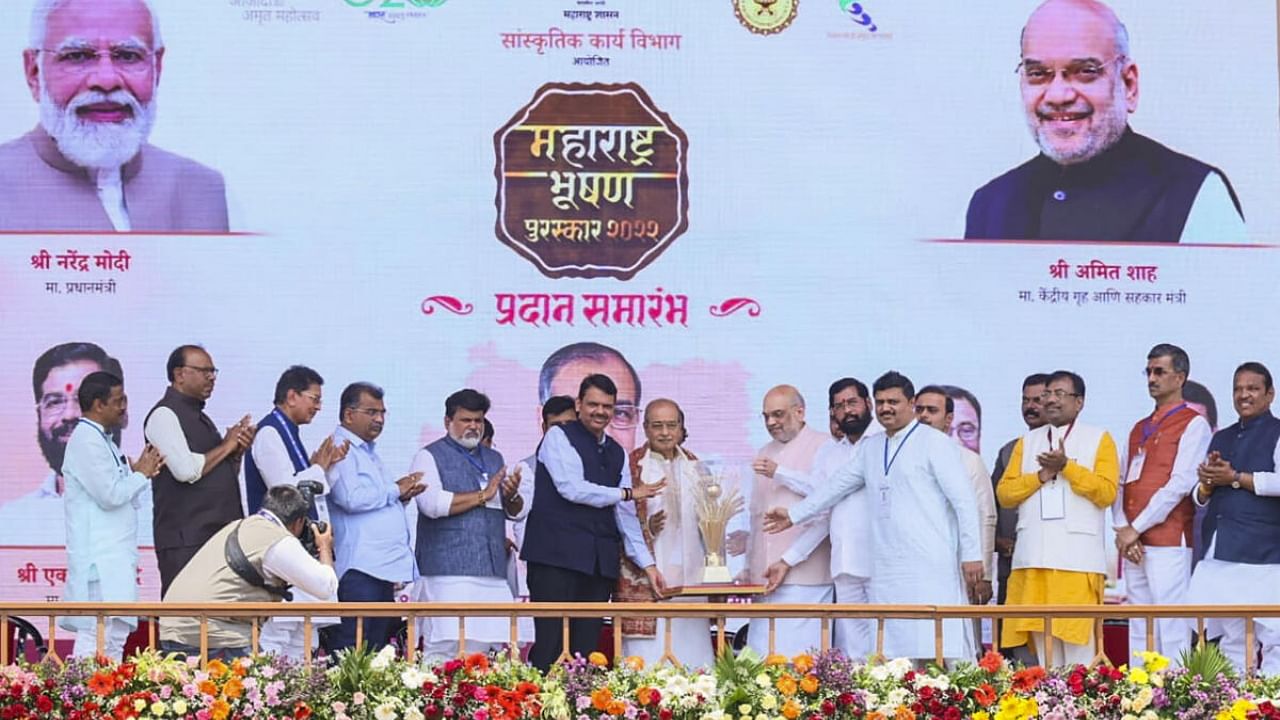 Union Home Minister Amit Shah confers the Maharashtra Bhushan Award 2022 on Social worker and reformer 'Nirupankar' Dattatreya Narayan Dharmadhikari, known as Appasaheb Dharmadhikari. Credit: PTI Photo