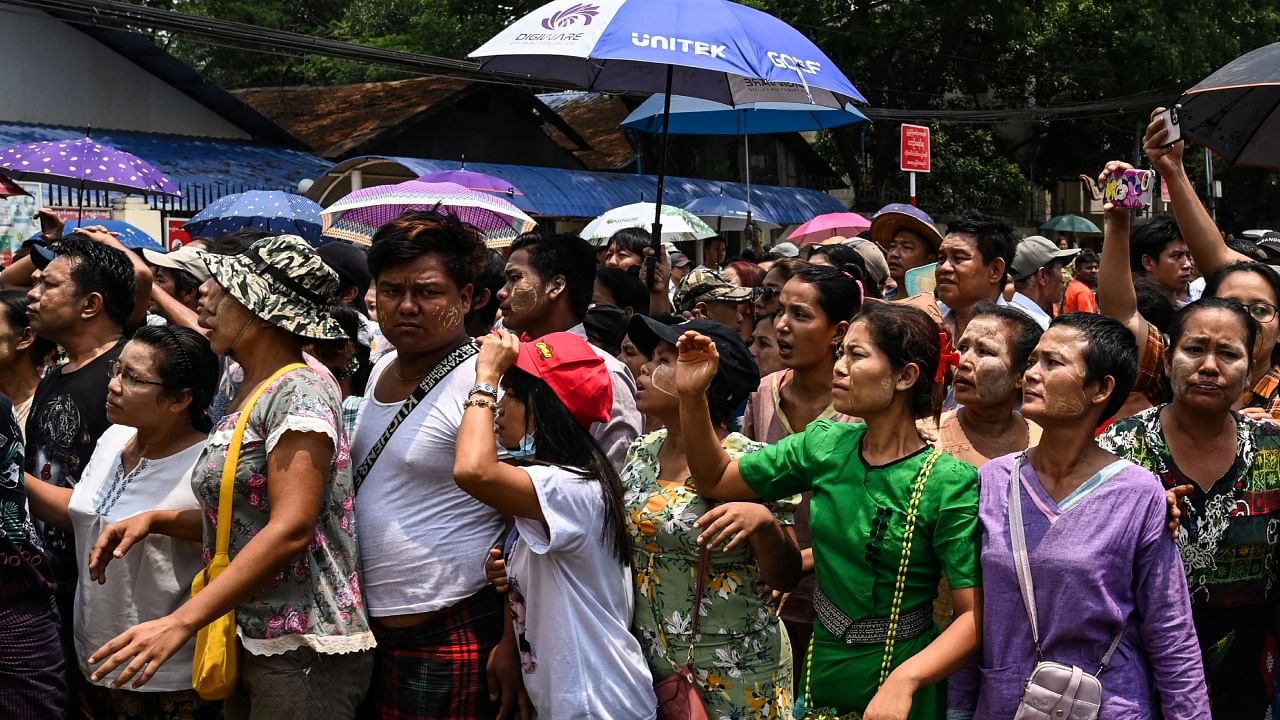 Relatives wait for the release of prisoners outside the Insein prison in Yangon on April 17, 2023. Myanmar's junta on April 17, 2023 began releasing more than 3,000 prisoners to mark the Buddhist New Year, without specifying whether those jailed in its bloody crackdown on dissent would be freed. Credit: AFP Photo