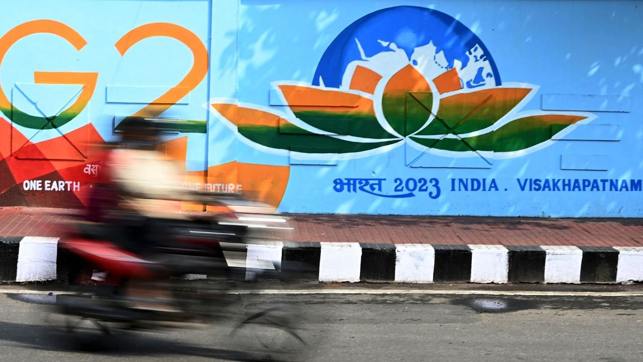 A wall mural of the G20 Summit logo along a street in Visakhapatnam. Credit: AFP Photo