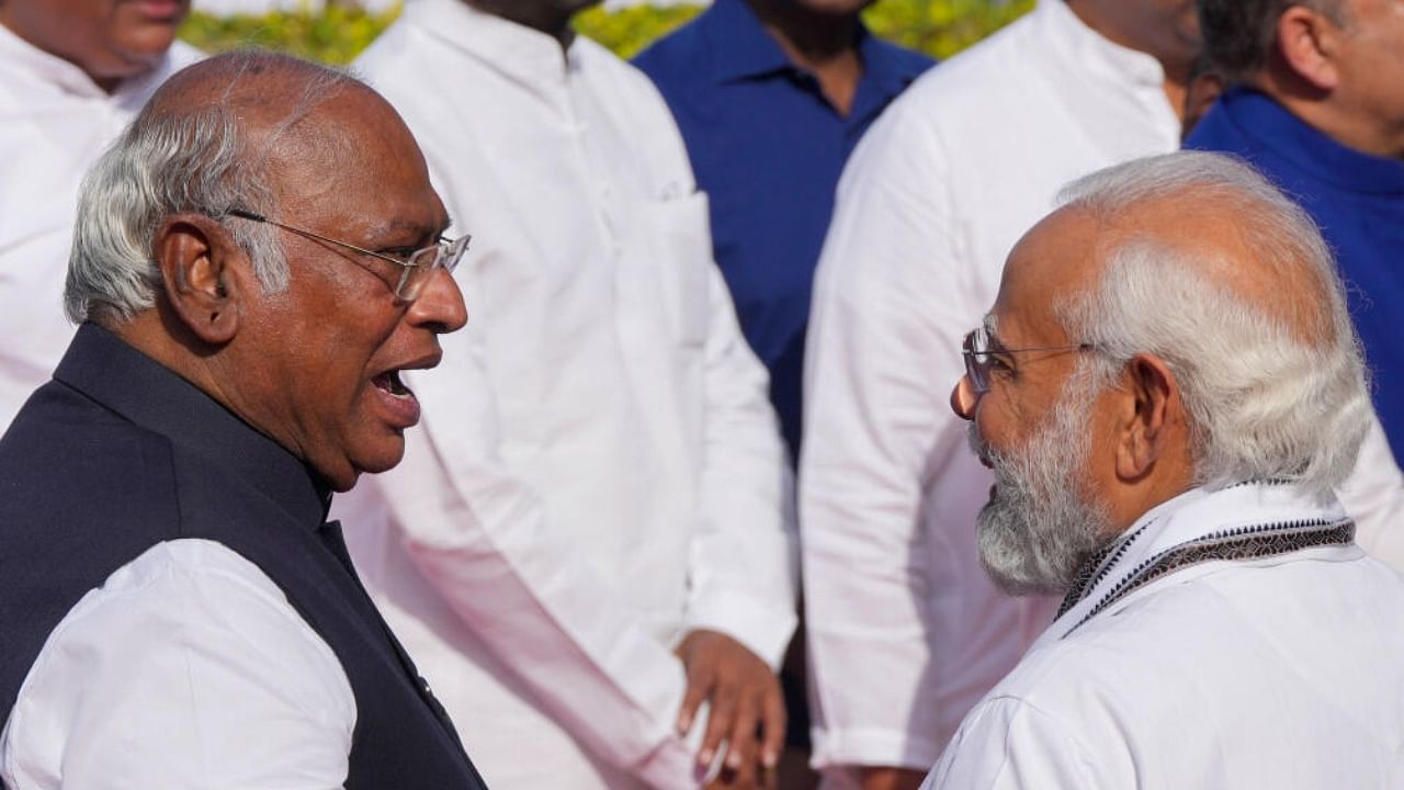 Prime Minister Narendra Modi with Congress President Mallikarjun Kharge. Credit: PTI Photo