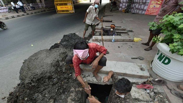 The employment of manual scavengers is prevented as per the ‘Prohibition of Employment as Manual Scavengers and their Rehabilitation Act, 2013’. Credit: PTI Photo