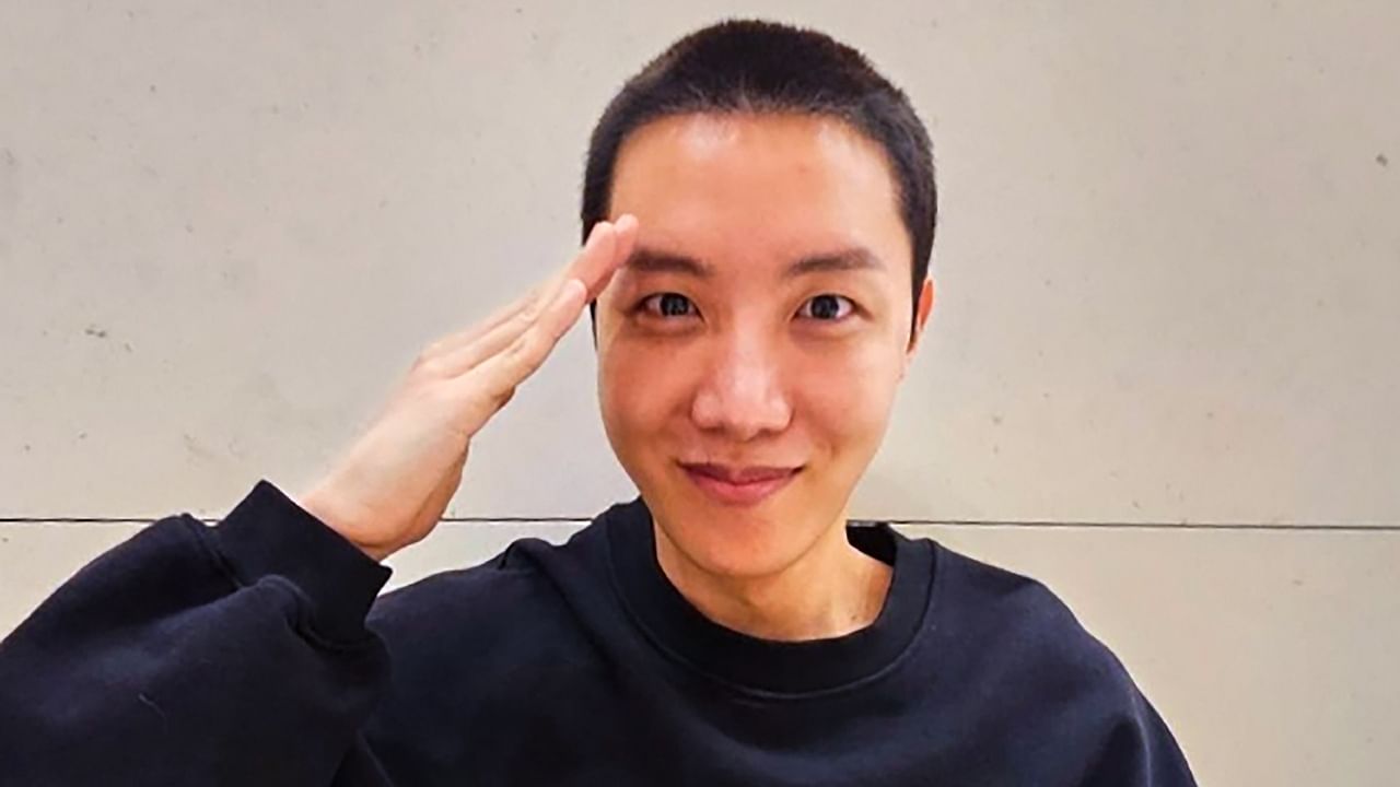 BTS member J-Hope shares picture with fans as he leaves for mandatory military duty. Credit: PTI Photo